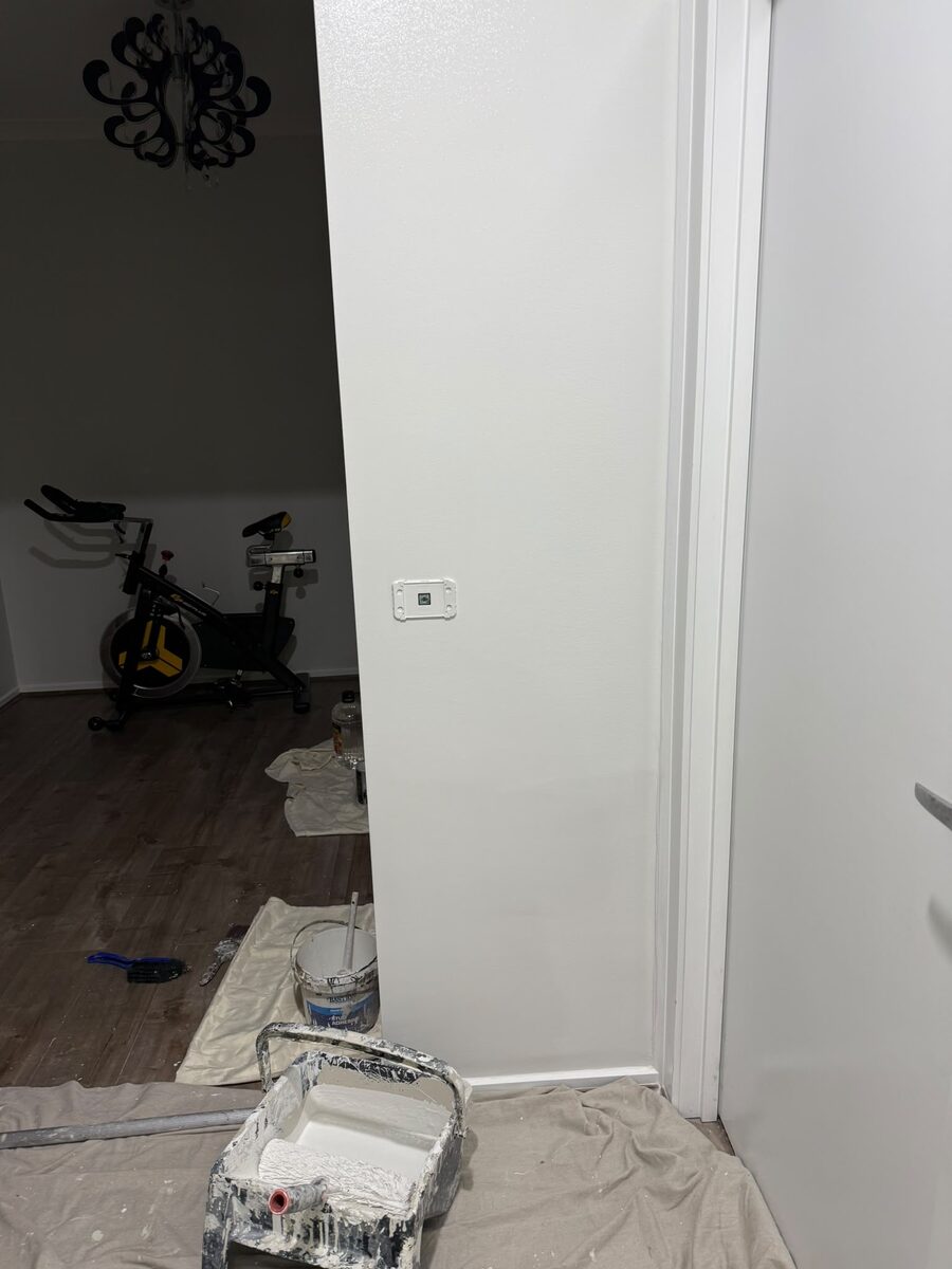 Interior room prepared and sheeted for painting