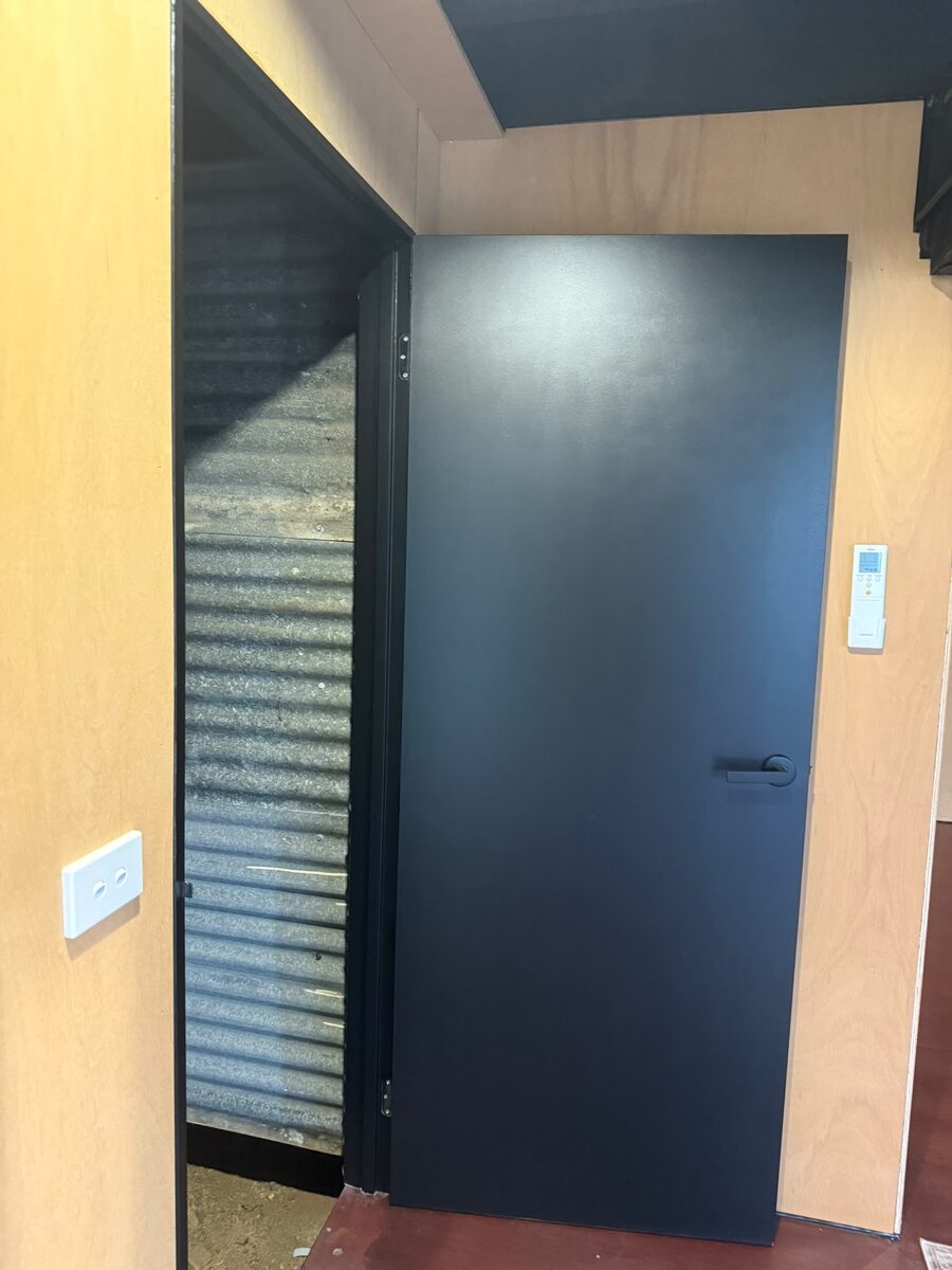 Front door painted in a deep navy feature colour